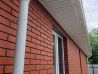 Труба водосточная ProfiDvice белая на объекте
